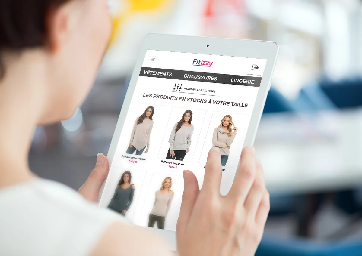 A Fitizzy tablet in hand, showing the recommended products